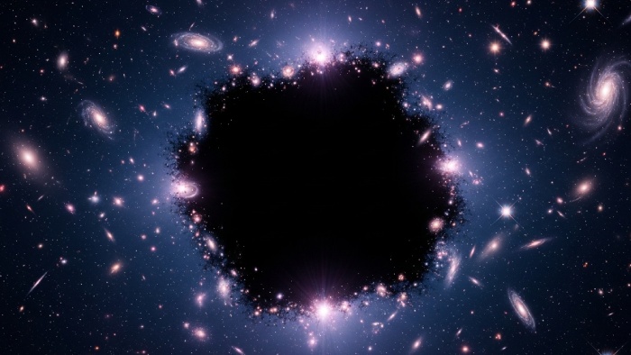 "Ilustración artística de la materia oscura en el universo, mostrada como una vasta región oscura rodeada de galaxias y luz cósmica.